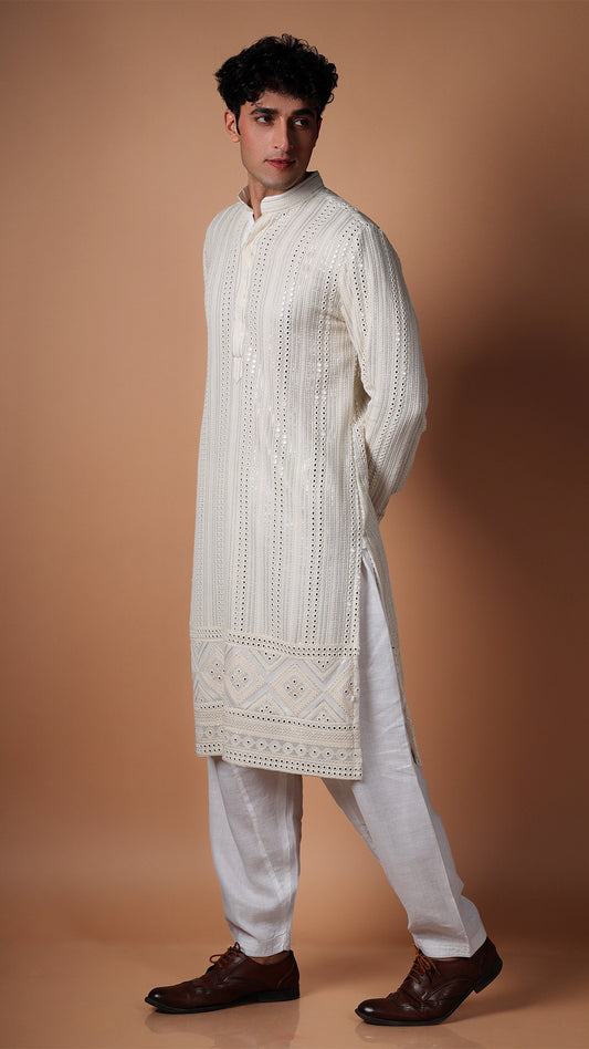 Side view of Off White Kurta with Vertical Panel Mirror Work, worn with white patiala and tan Oxford shoes