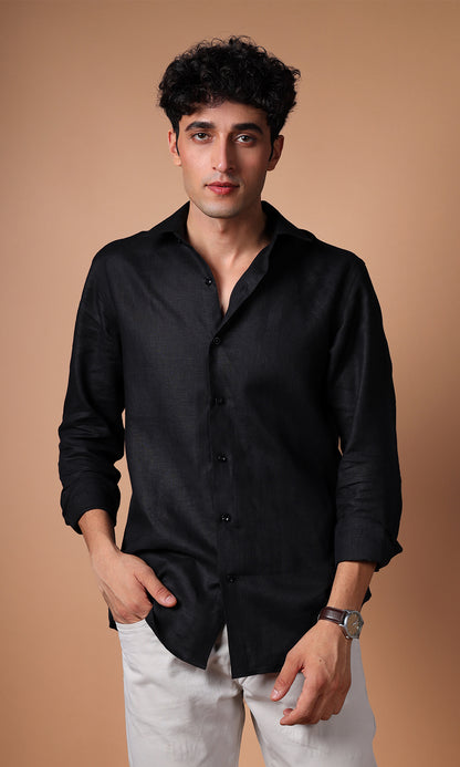 Model in a black linen shirt, exuding sophistication and a formal flair.