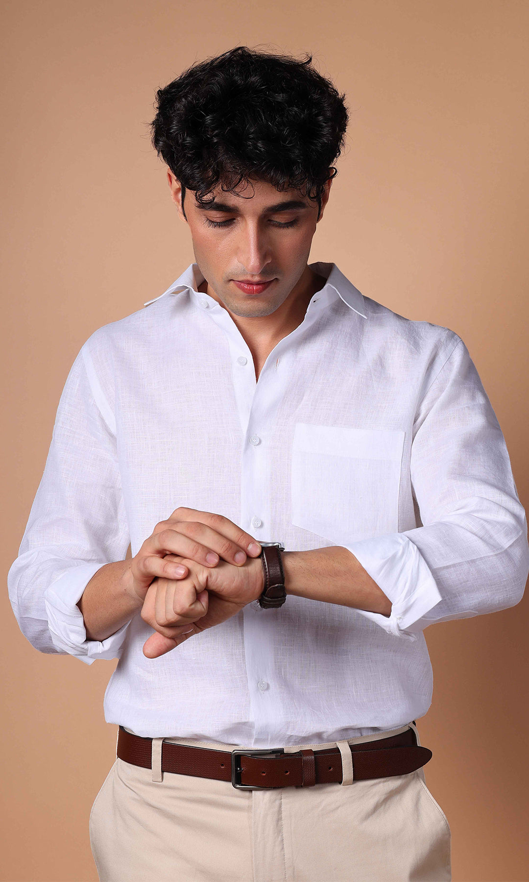 Front view of a white linen shirt on a model, highlighting a pristine and elegant look